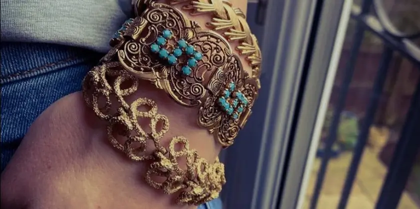 Stack of vintage bracelets on a wrist