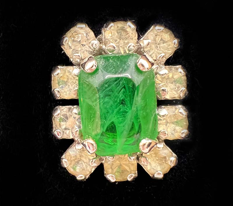 Closeup of costume jewellery flawed emerald green glass