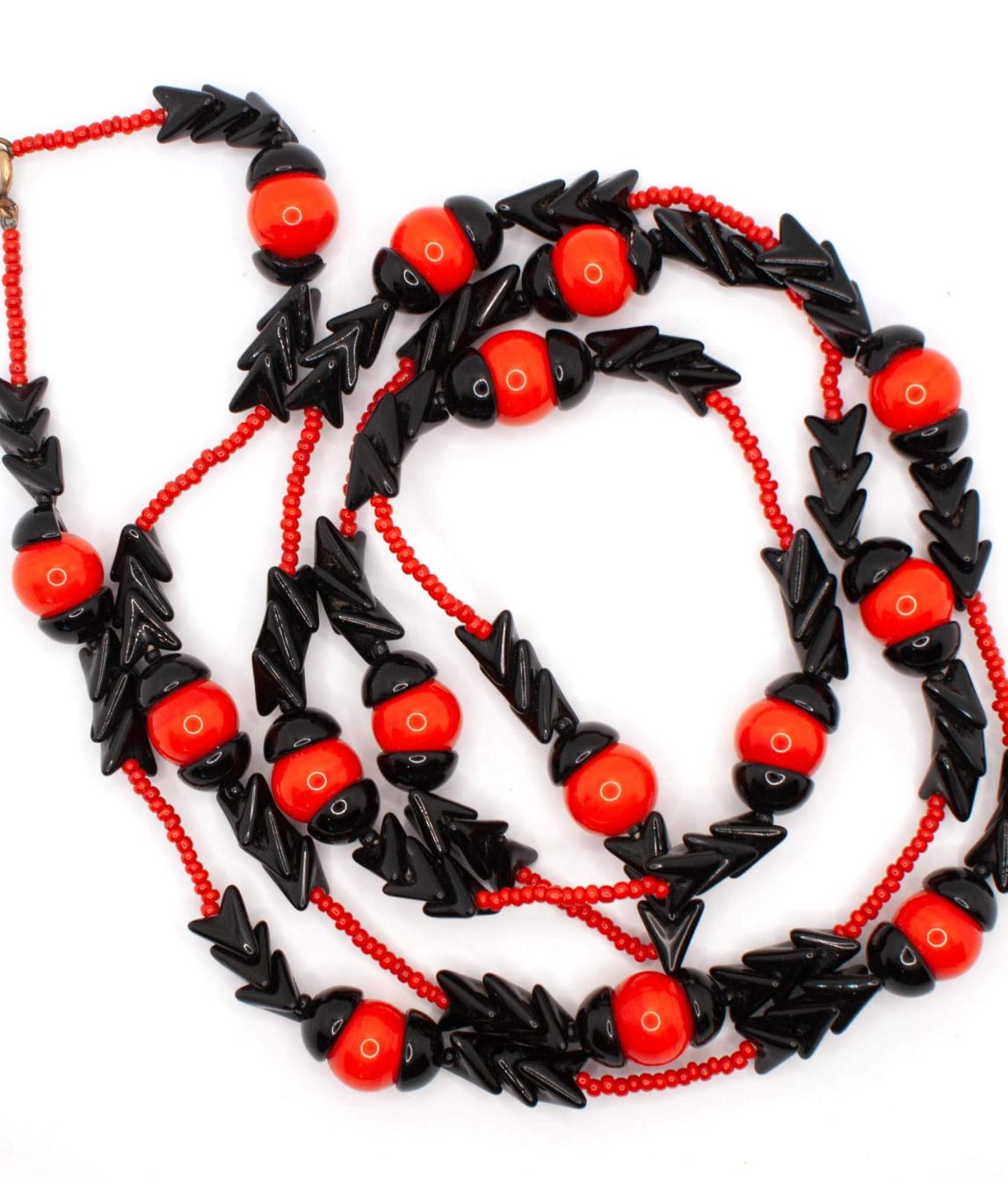 Long beaded necklace by Miriam Haskell with red and black arrow beads