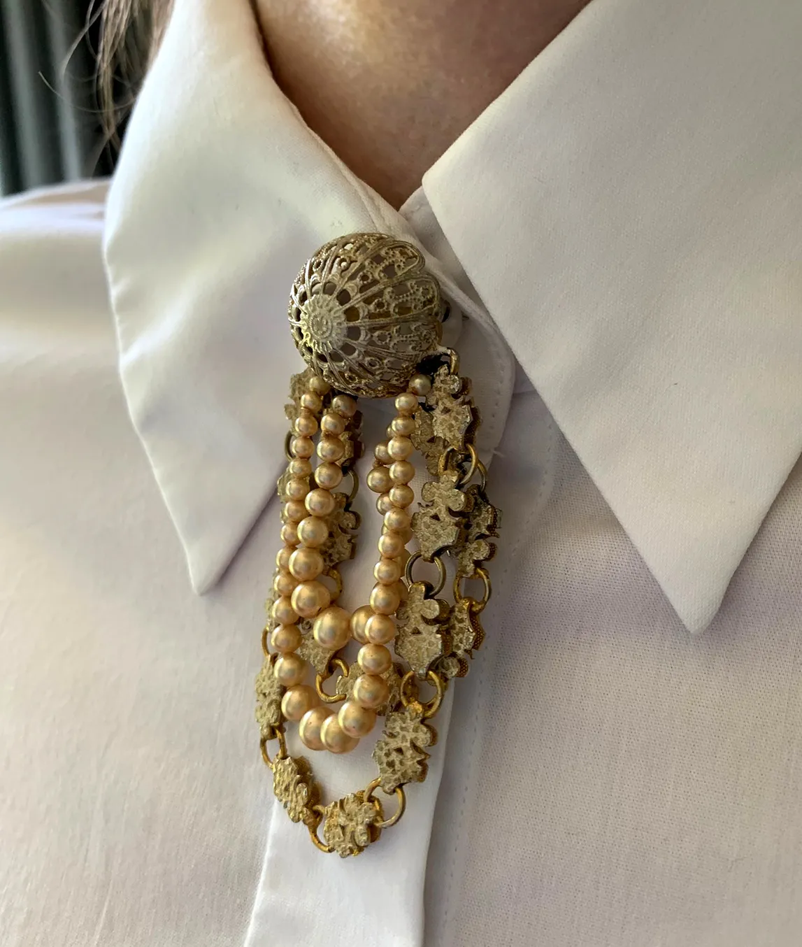 Mitchel Maer brooch with white shirt collar