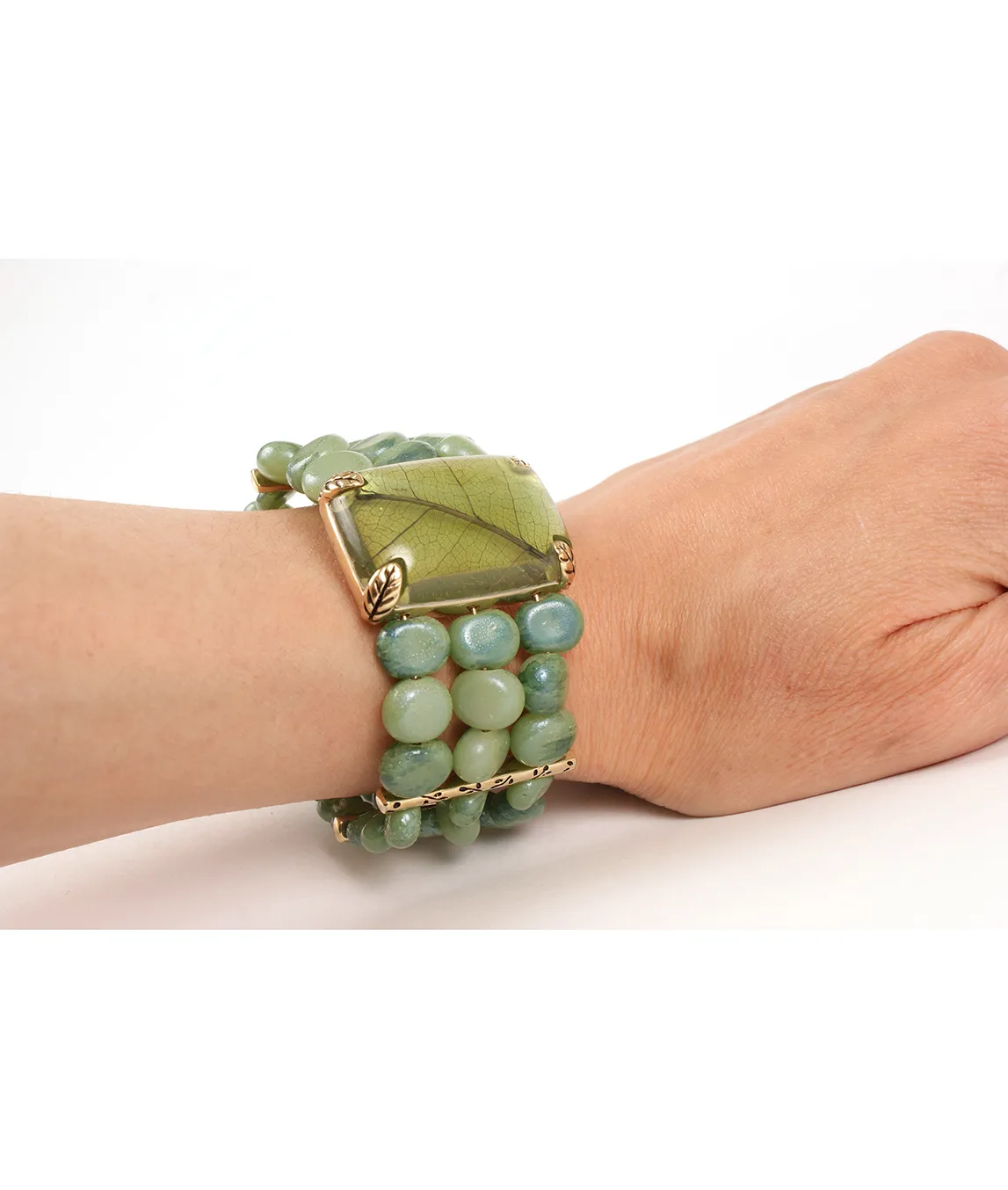 Green beaded bracelet on wrist
