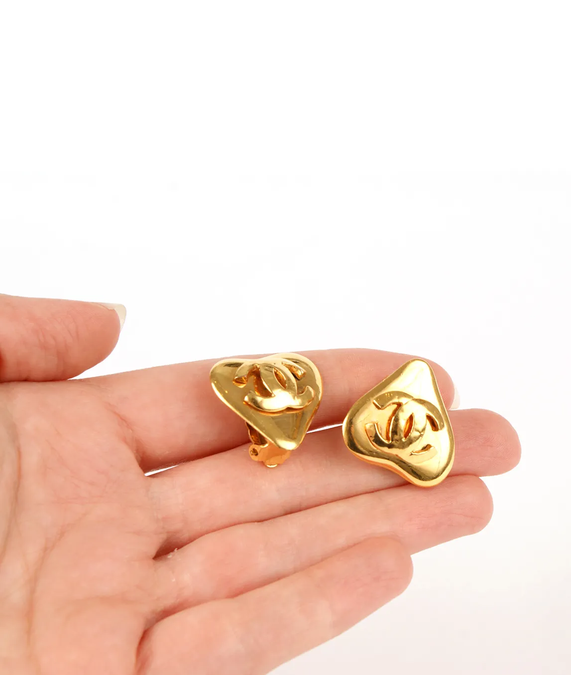 Chanel heart earrings in the hand