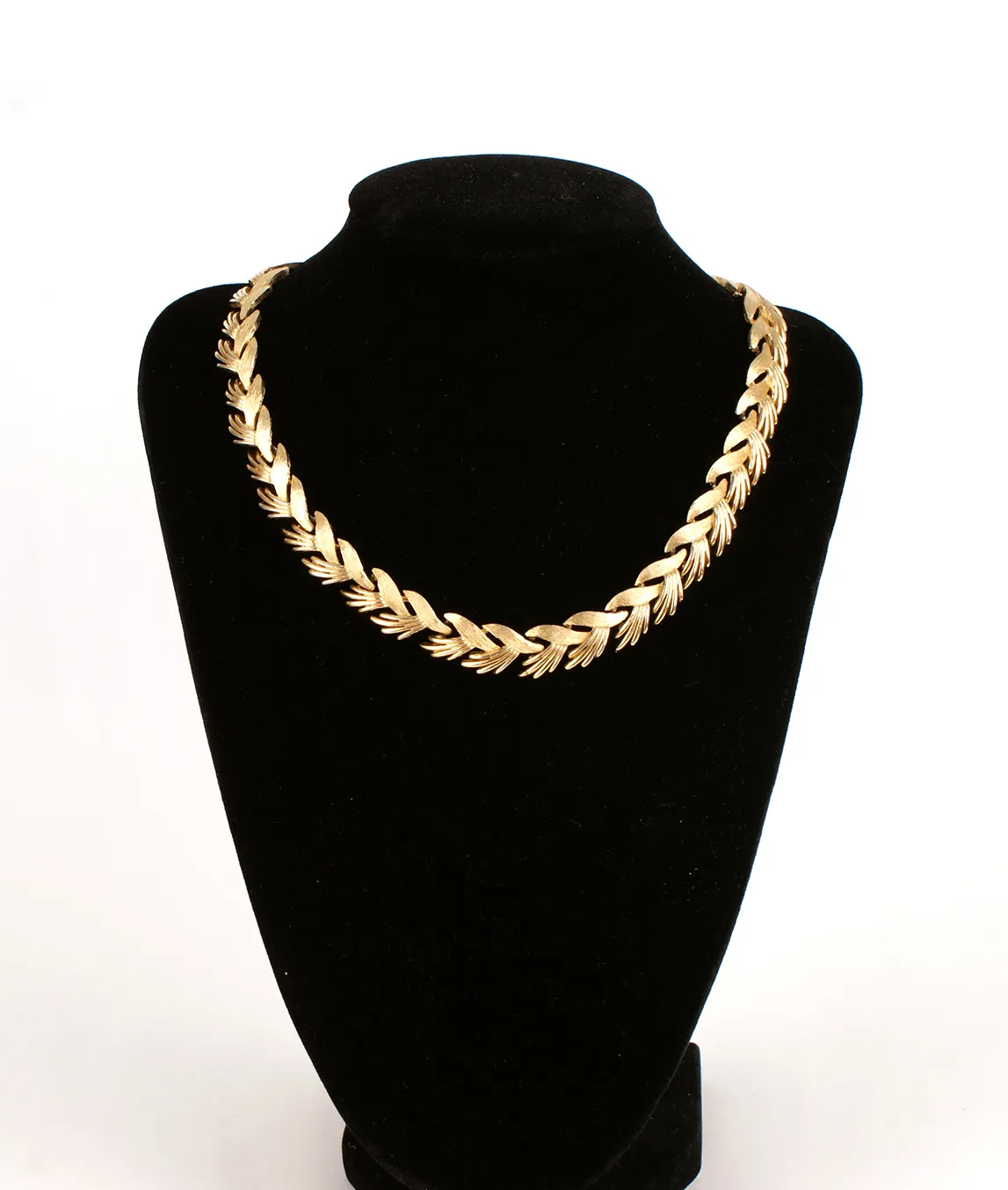 Trifari necklace on stand