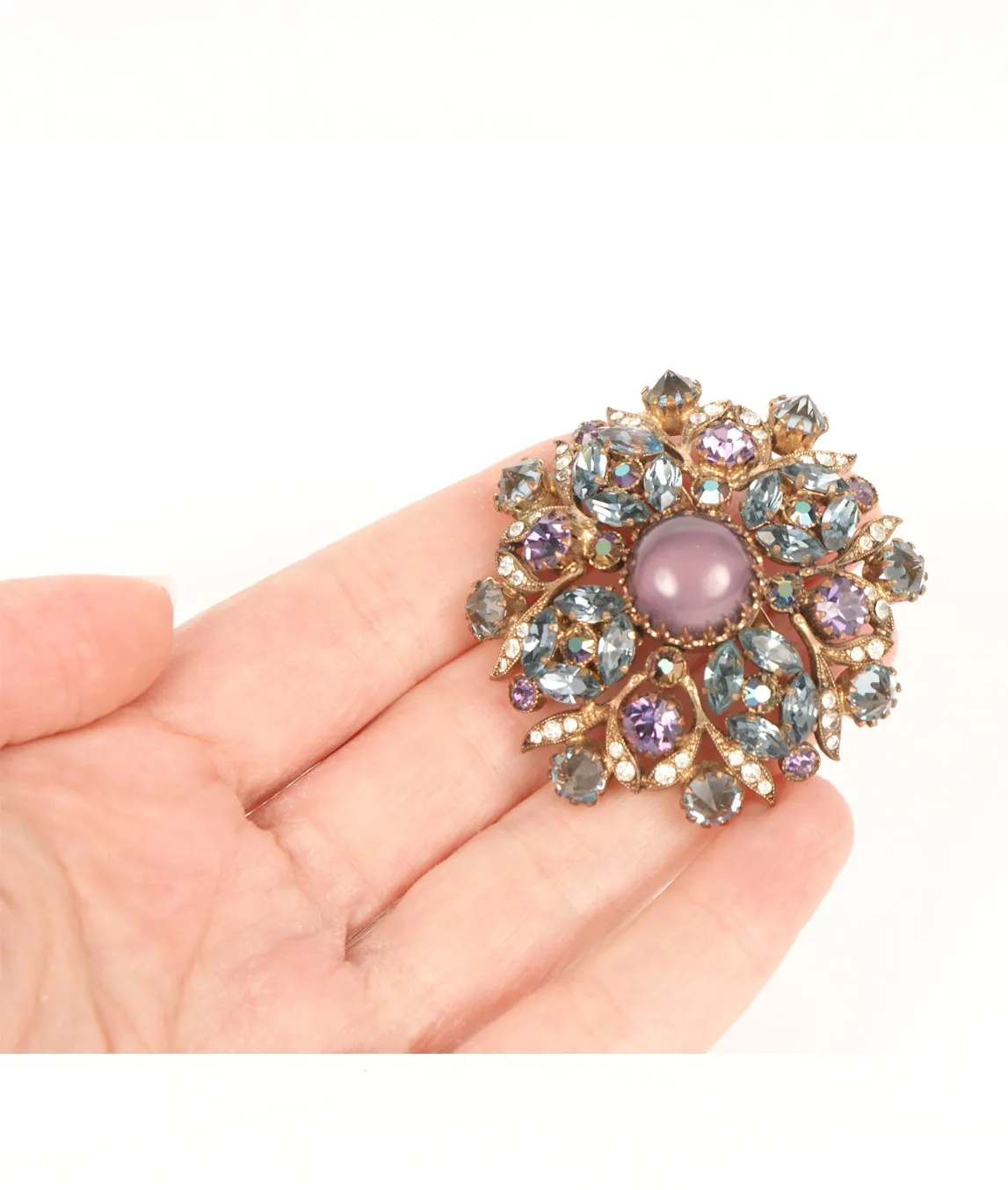 Large vintage crystal brooch in the hand