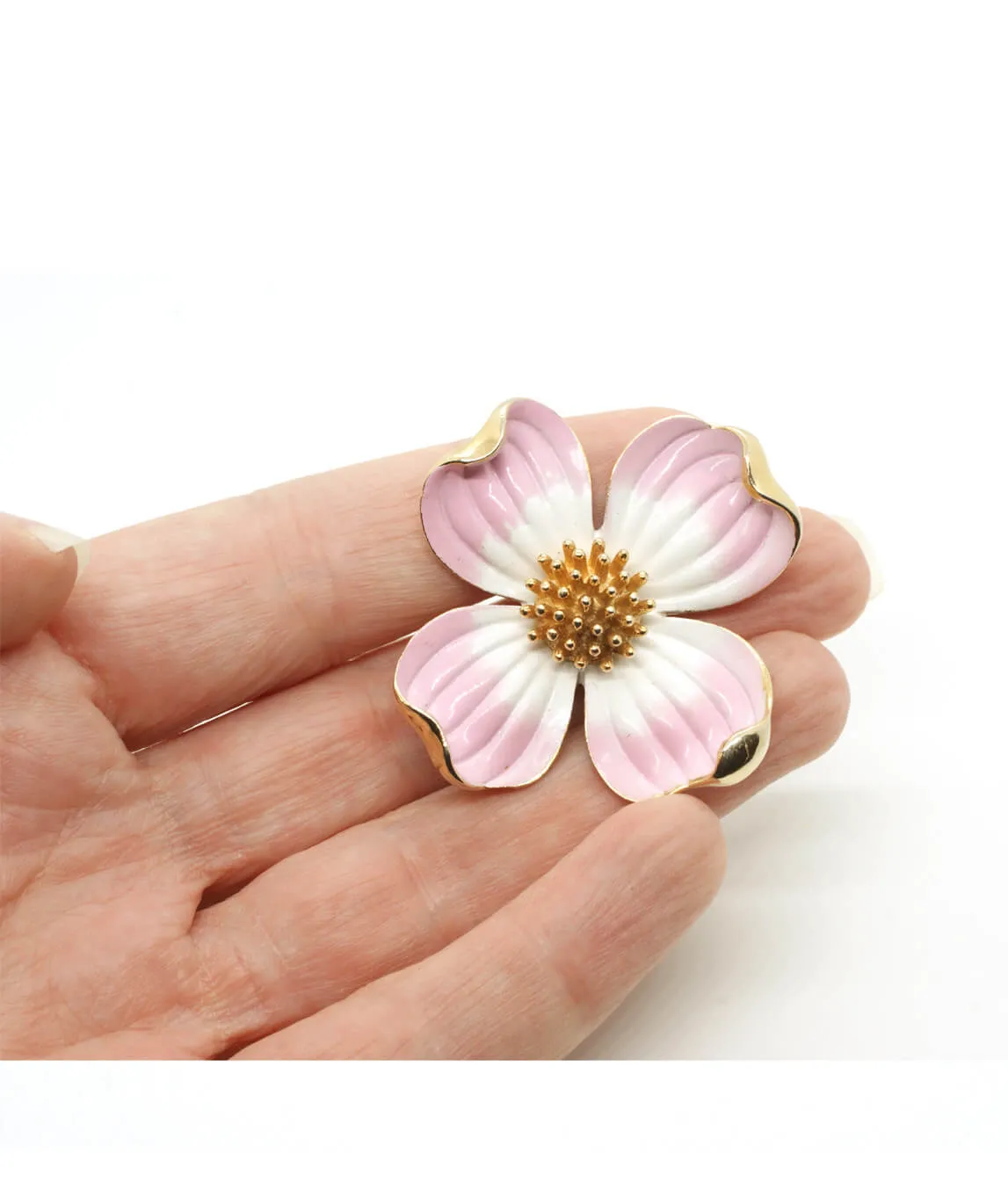 Crown Trifari dogwood flower brooch in the hand