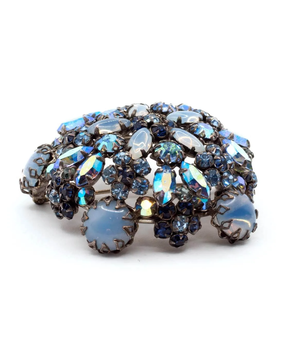 Tall Schreiner brooch with blue crystals and gems