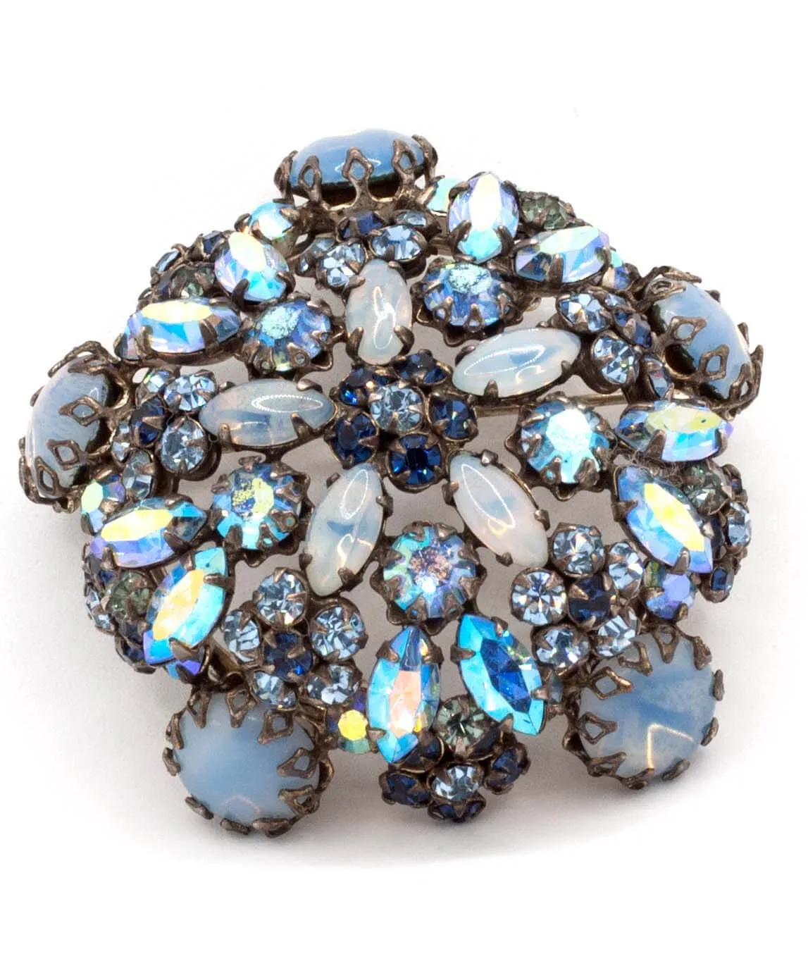 A large vintage Schreiner brooch with blue moonstones