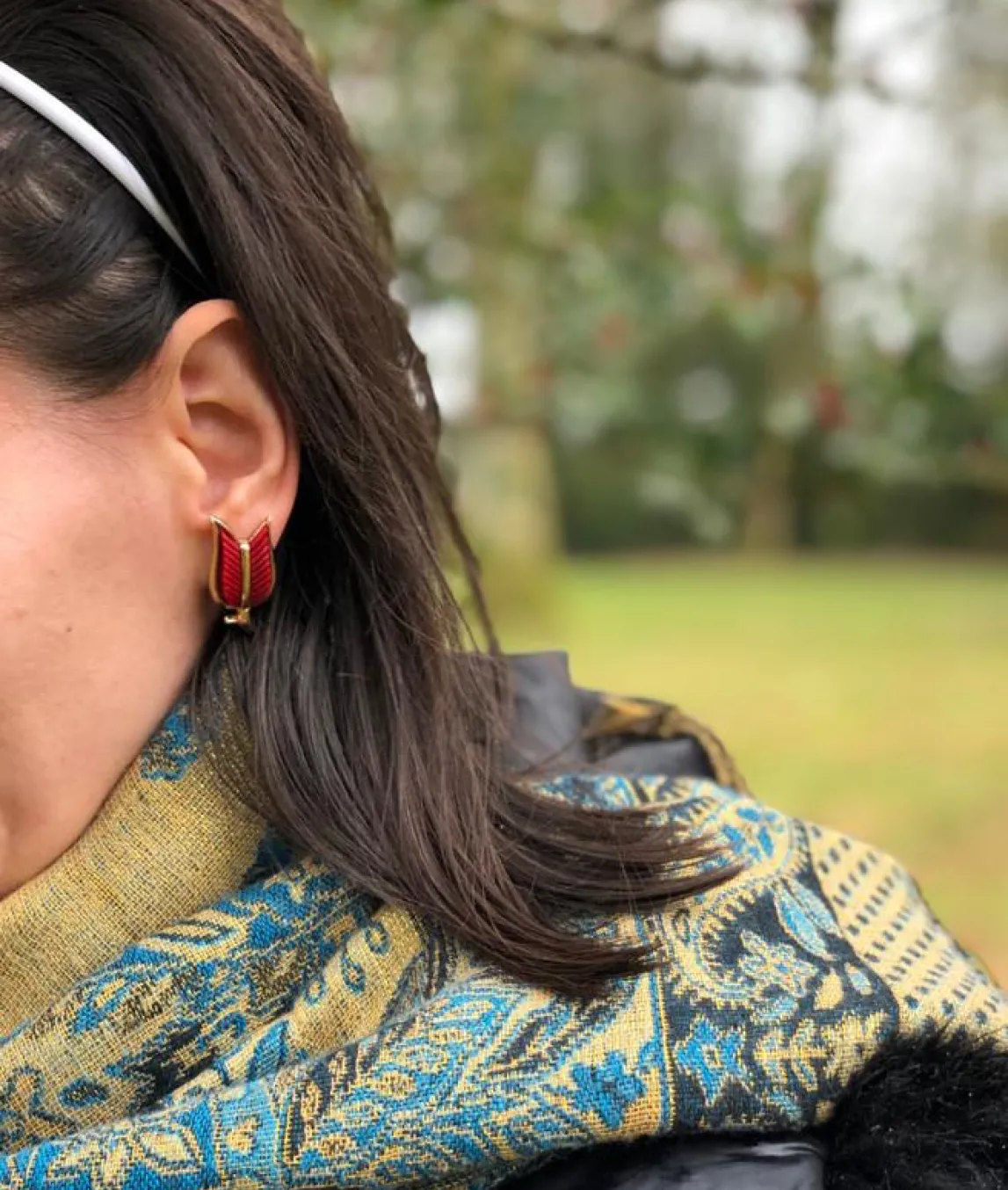Trifari earrings on person