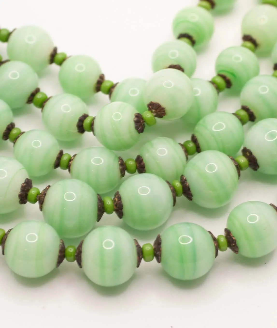 Green glass beads on Miriam Haskell necklace