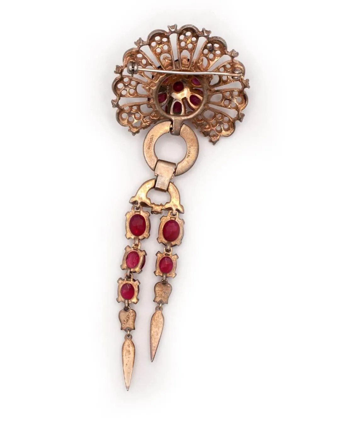 Reverse of Trifari Sterling dangle brooch with red crystals