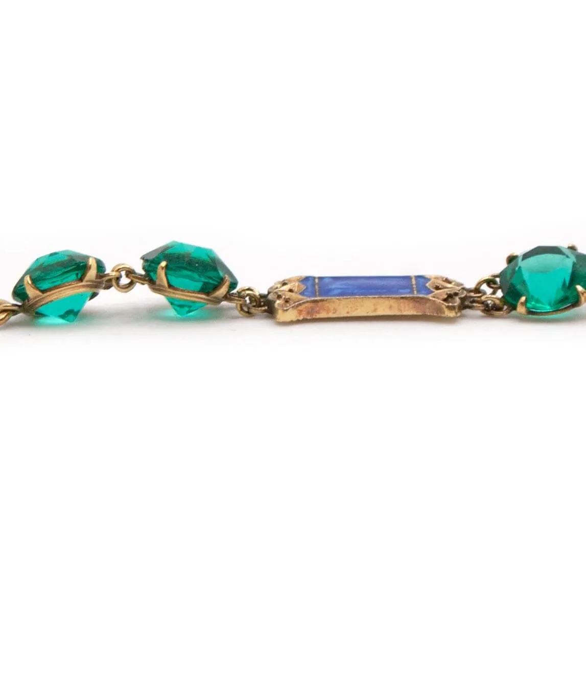 Closeup of green glass gems on Art Deco bracelet