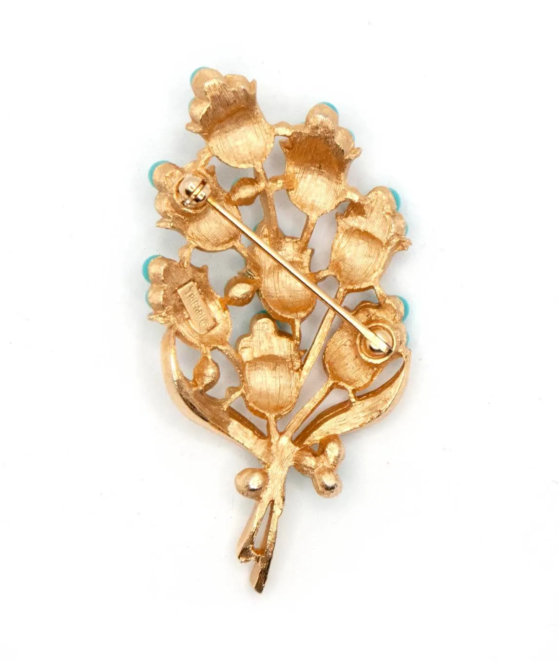 Vintage Trifari floral brooch in gold tone reverse