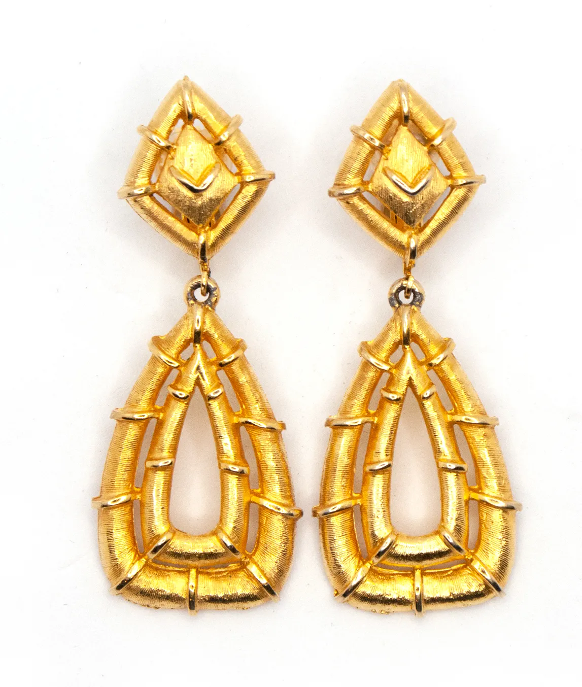 Gold bamboo dangle earrings by Polcini
