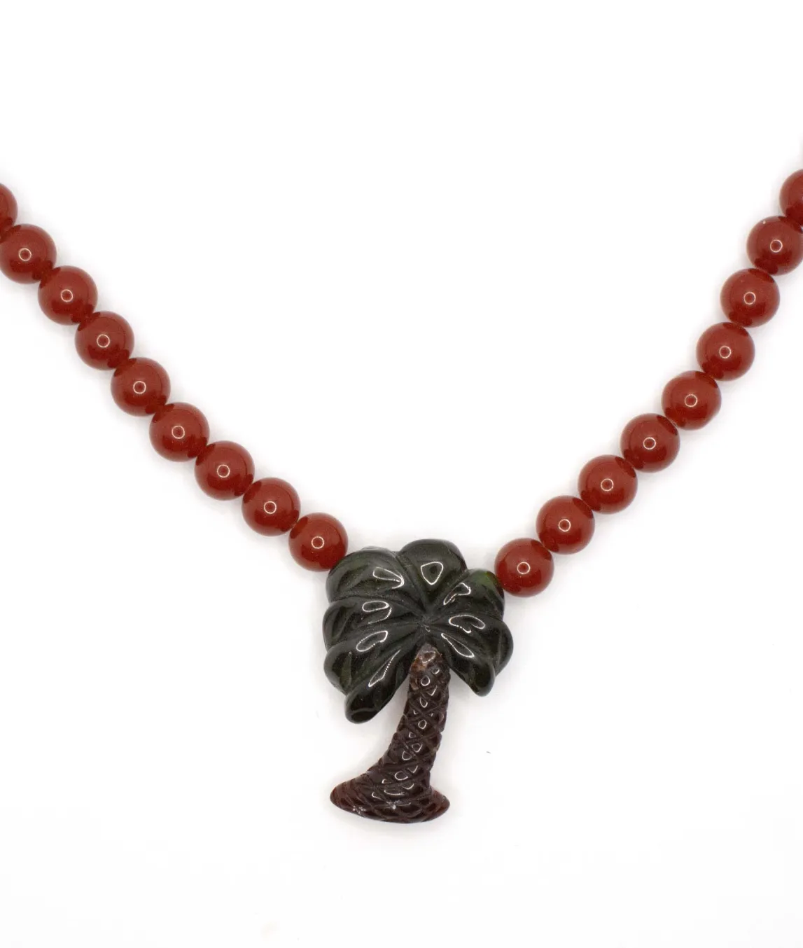 Carved palm tree pendant green with brown trunk on beaded necklace