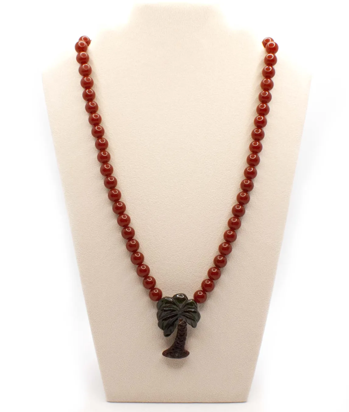 Vintage plastic beaded necklace with palm tree pendant