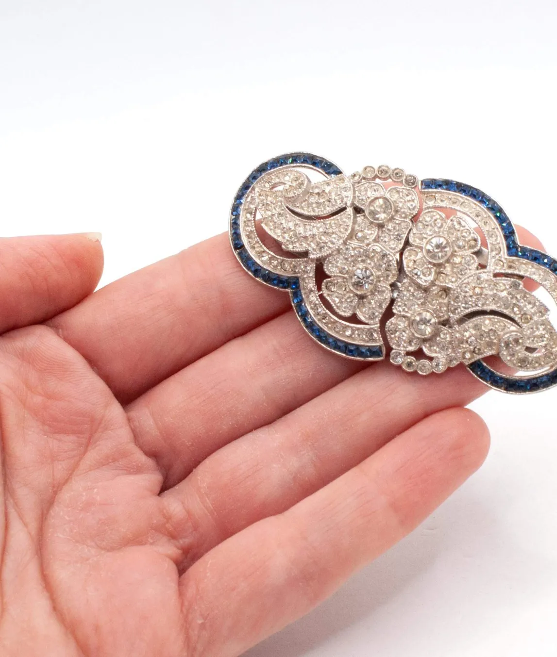 Art Deco Floral Double Clip Brooch held in a hand