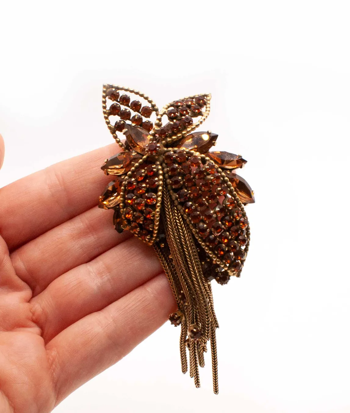 Large Vendôme Amber Floral Brooch in hand