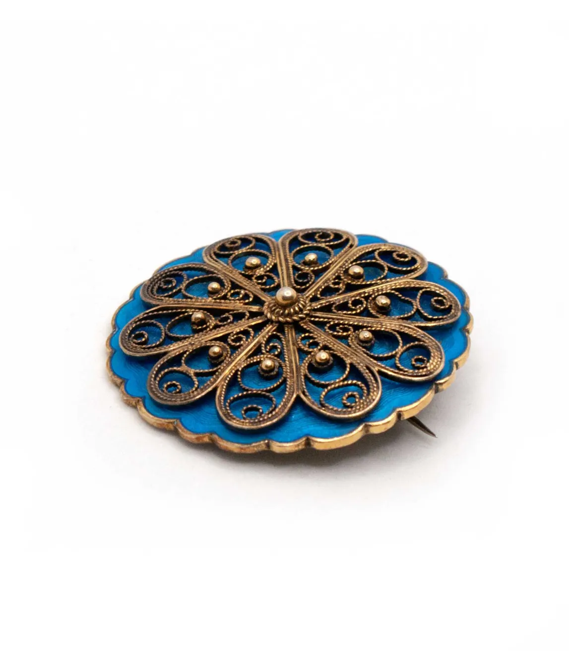 Profile showing filigree work on blue enamel brooch