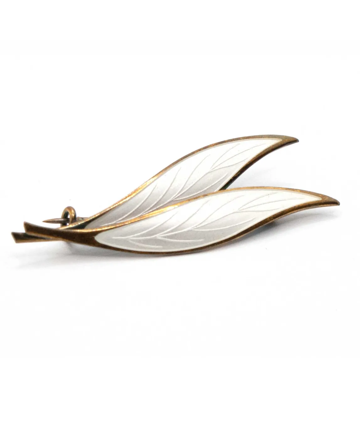 Double leaf brooch decorated with white enamel with a gold plated perimeter and stems