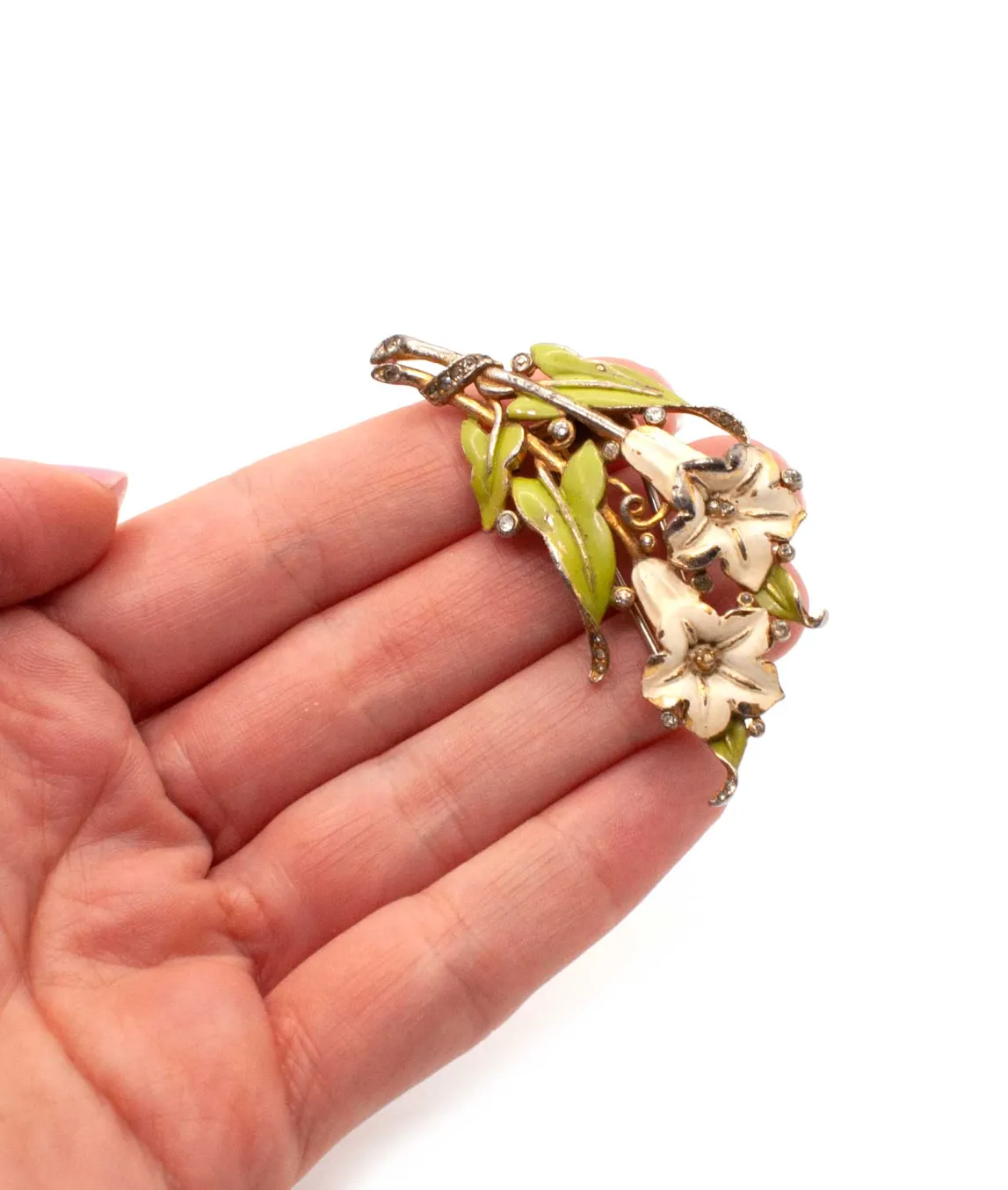 1930s enamel brooch with green leaves and two ivory flowers