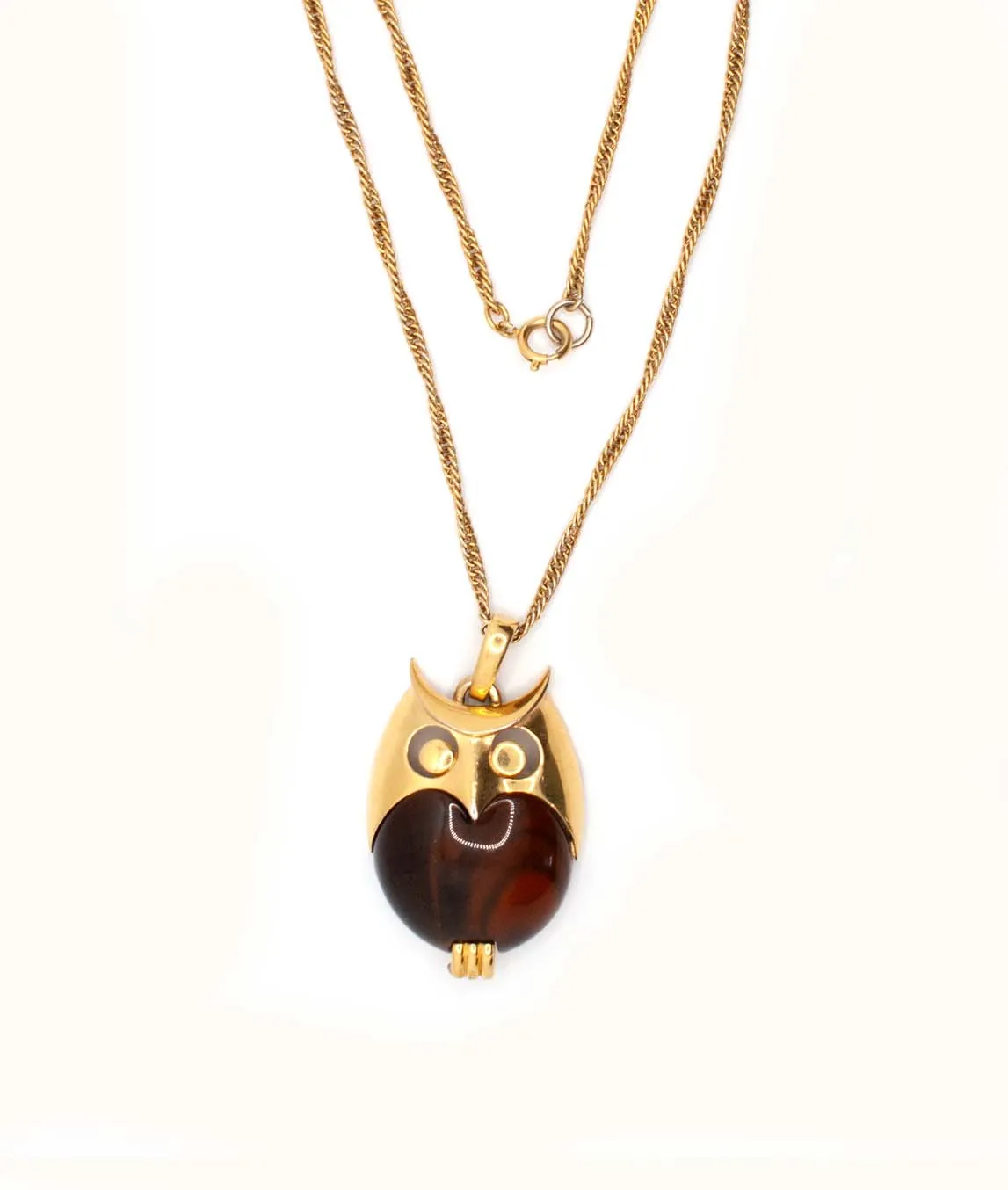 Top view of brown Trifari owl pendant on gold coloured chain