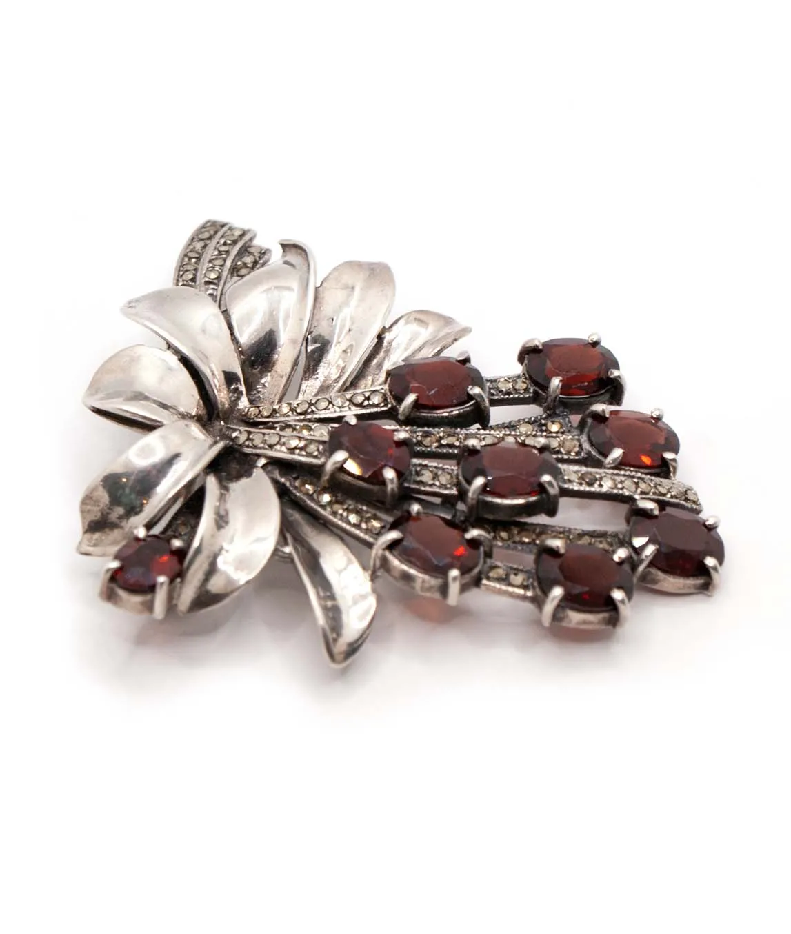 Silver and marcasite brooch with garnet red paste stones profile view