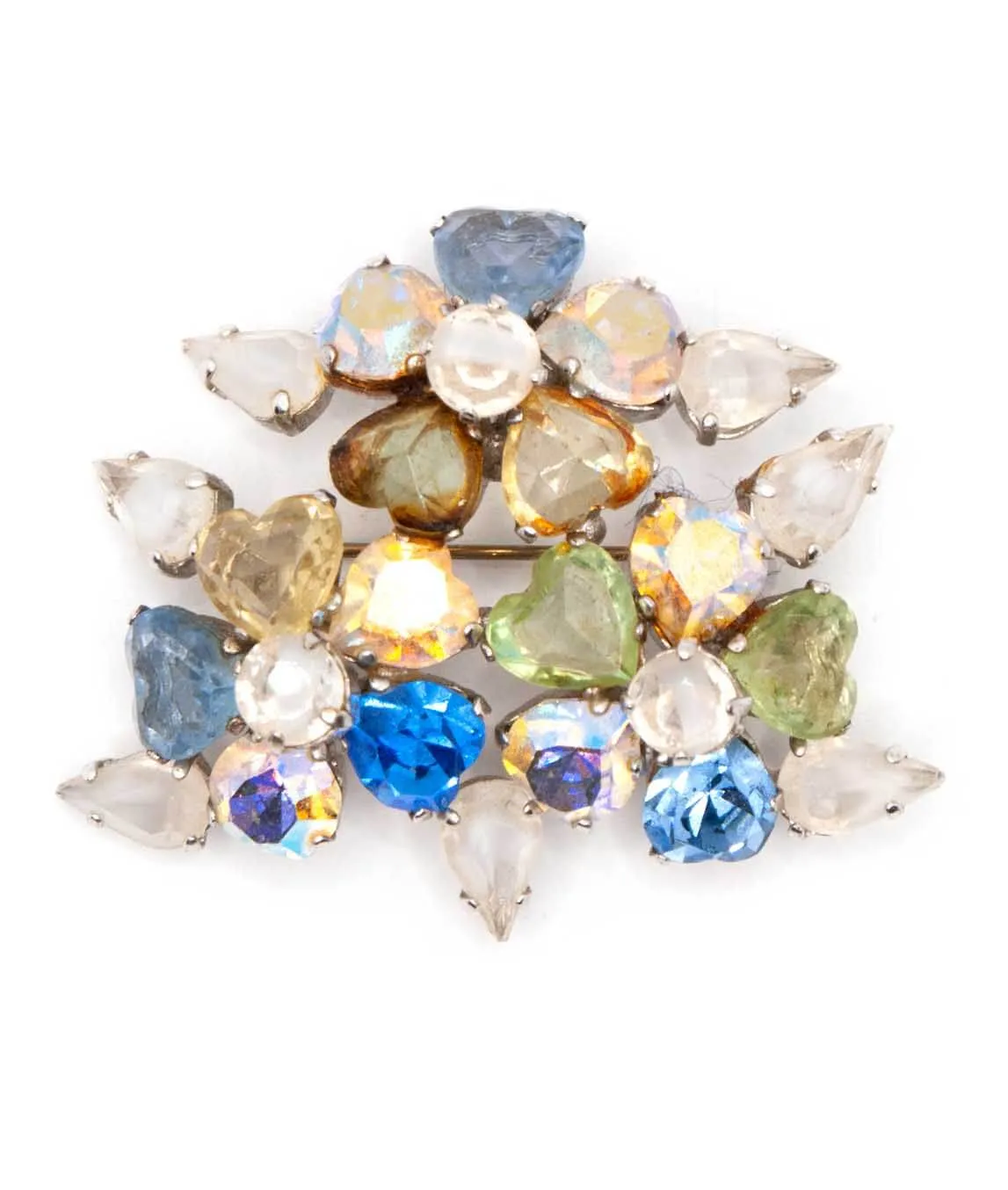 Top view of Christian Dior flower brooch composed of heart shaped crystals 