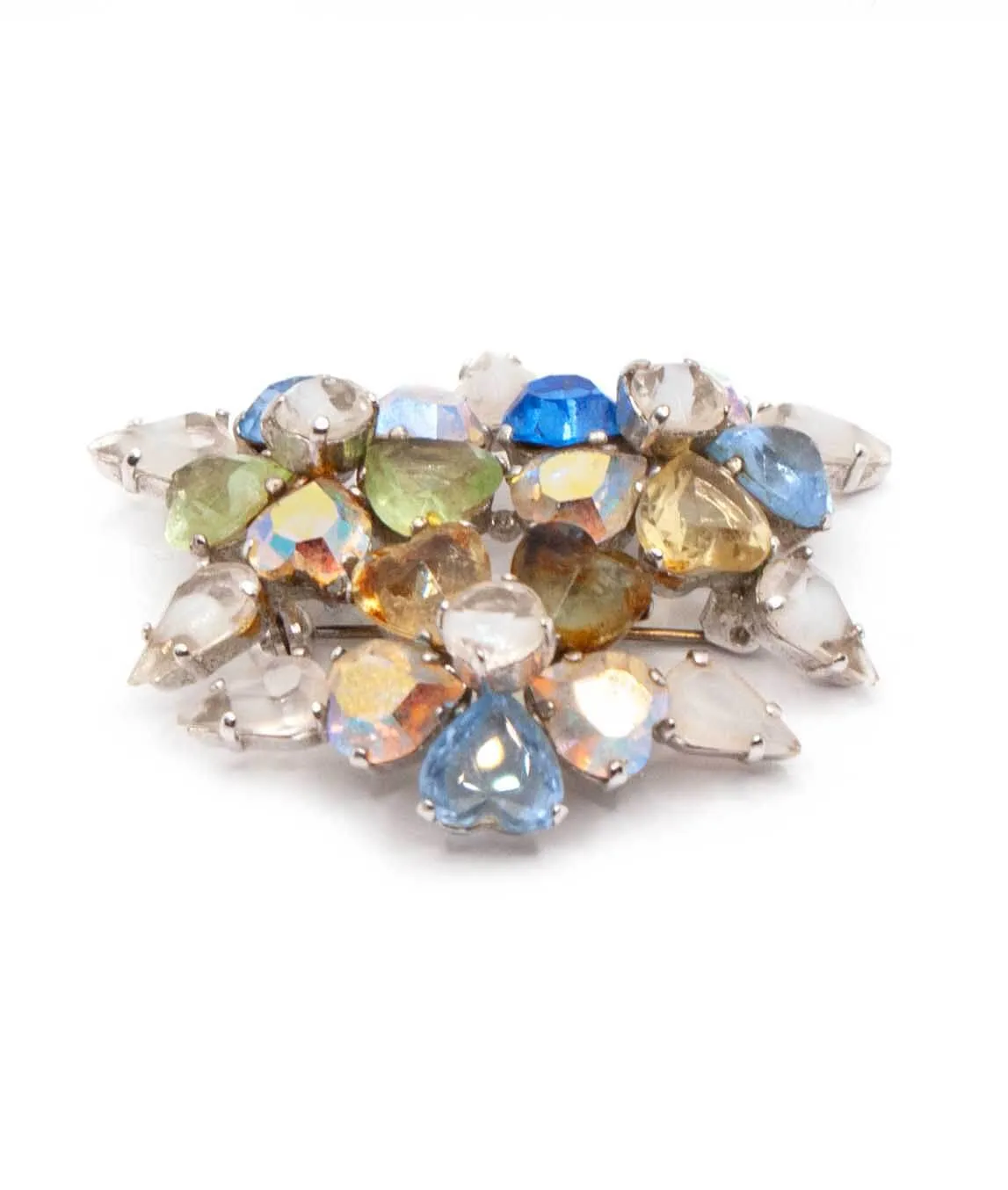 Side view of Christian Dior vintage brooch with blue and clear crystal gems