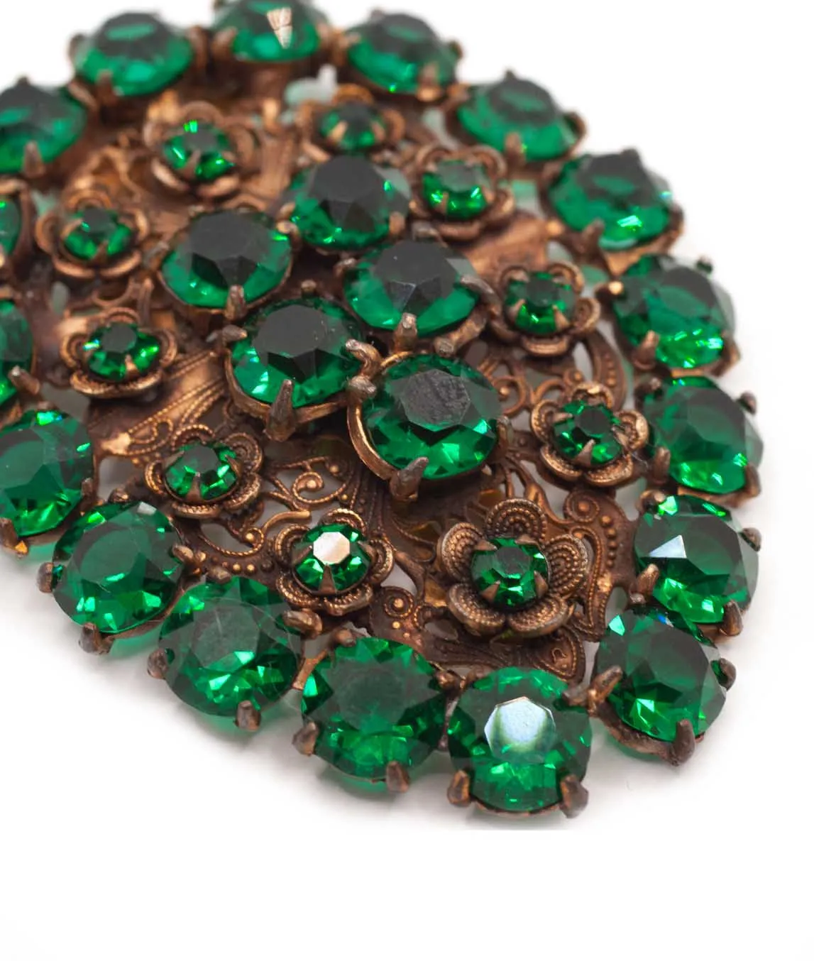 Dress clip set with dark emerald green glass crystals close look at flower settings