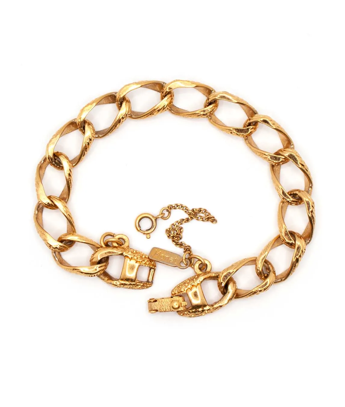 Gold tone vintage Monet charm link bracelet with safety chain top view