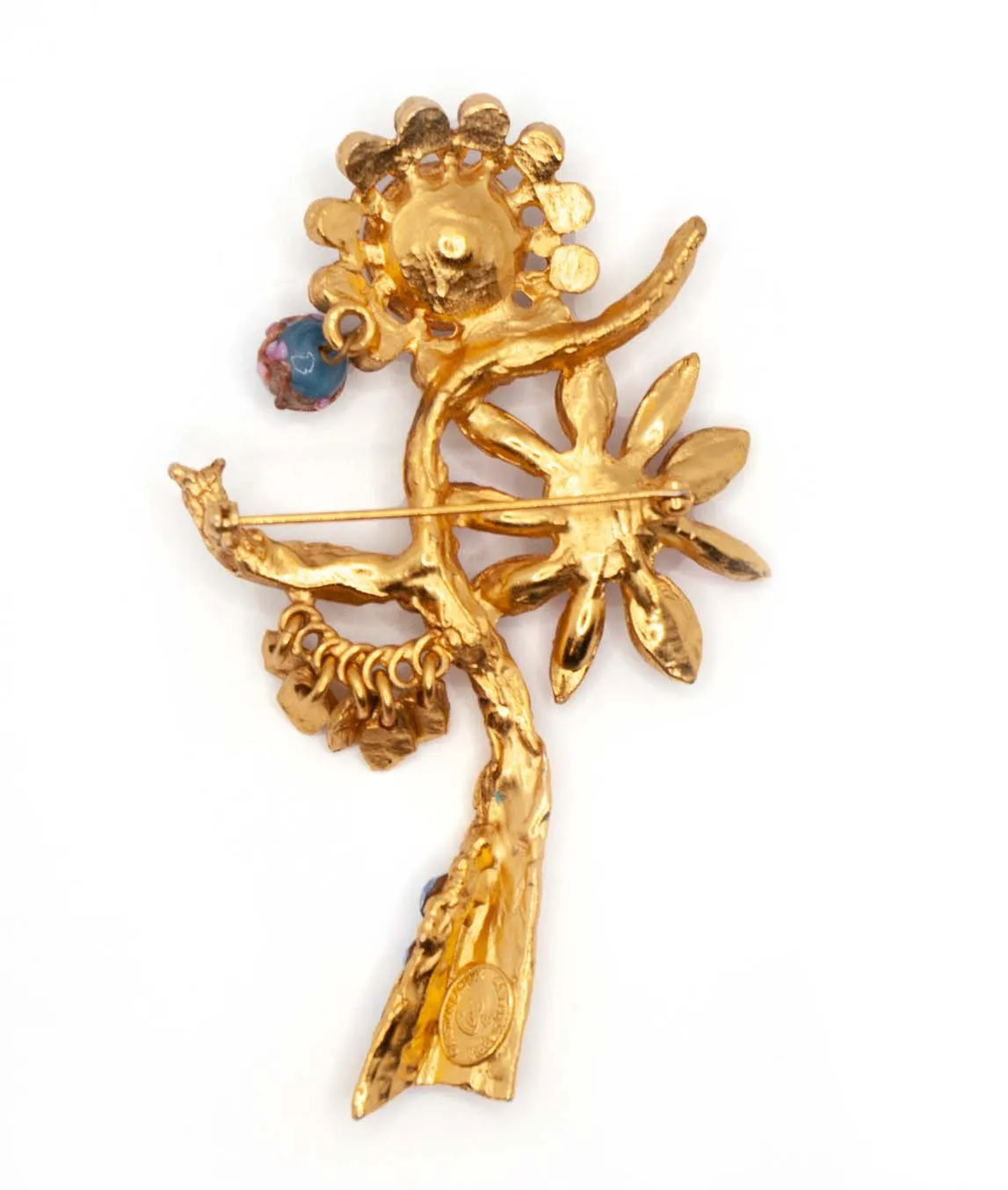 Back of gold plated Christian Lacroix flower brooch with art glass bead