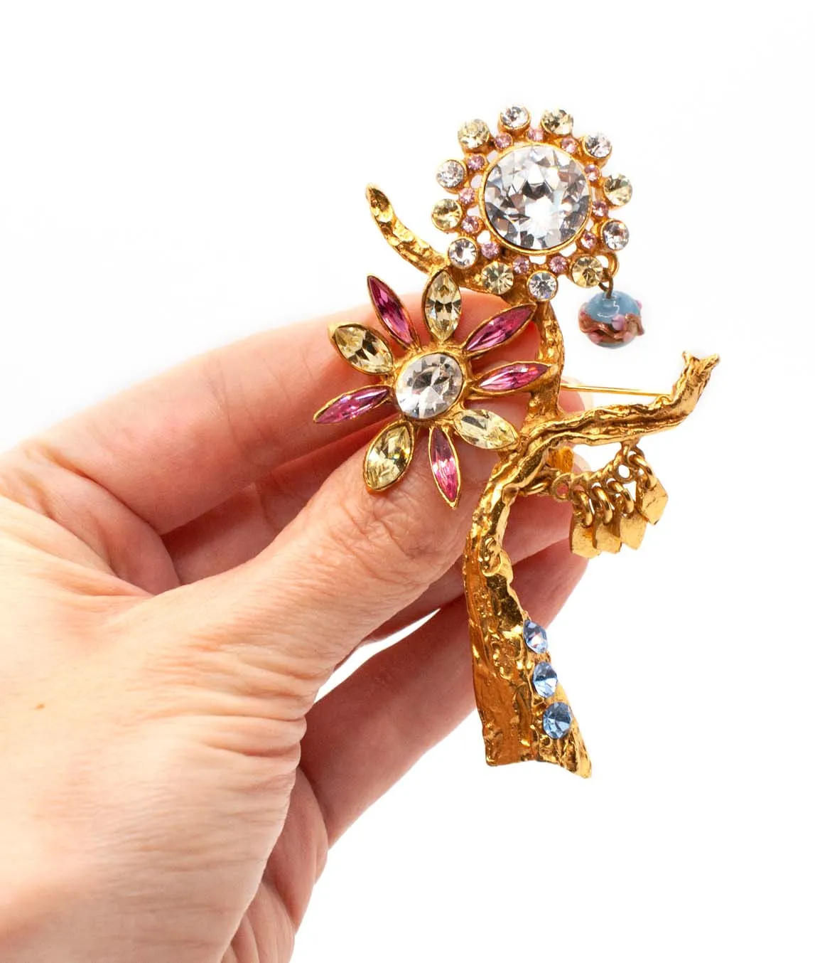 Large Christian Lacroix brooch held in a hand