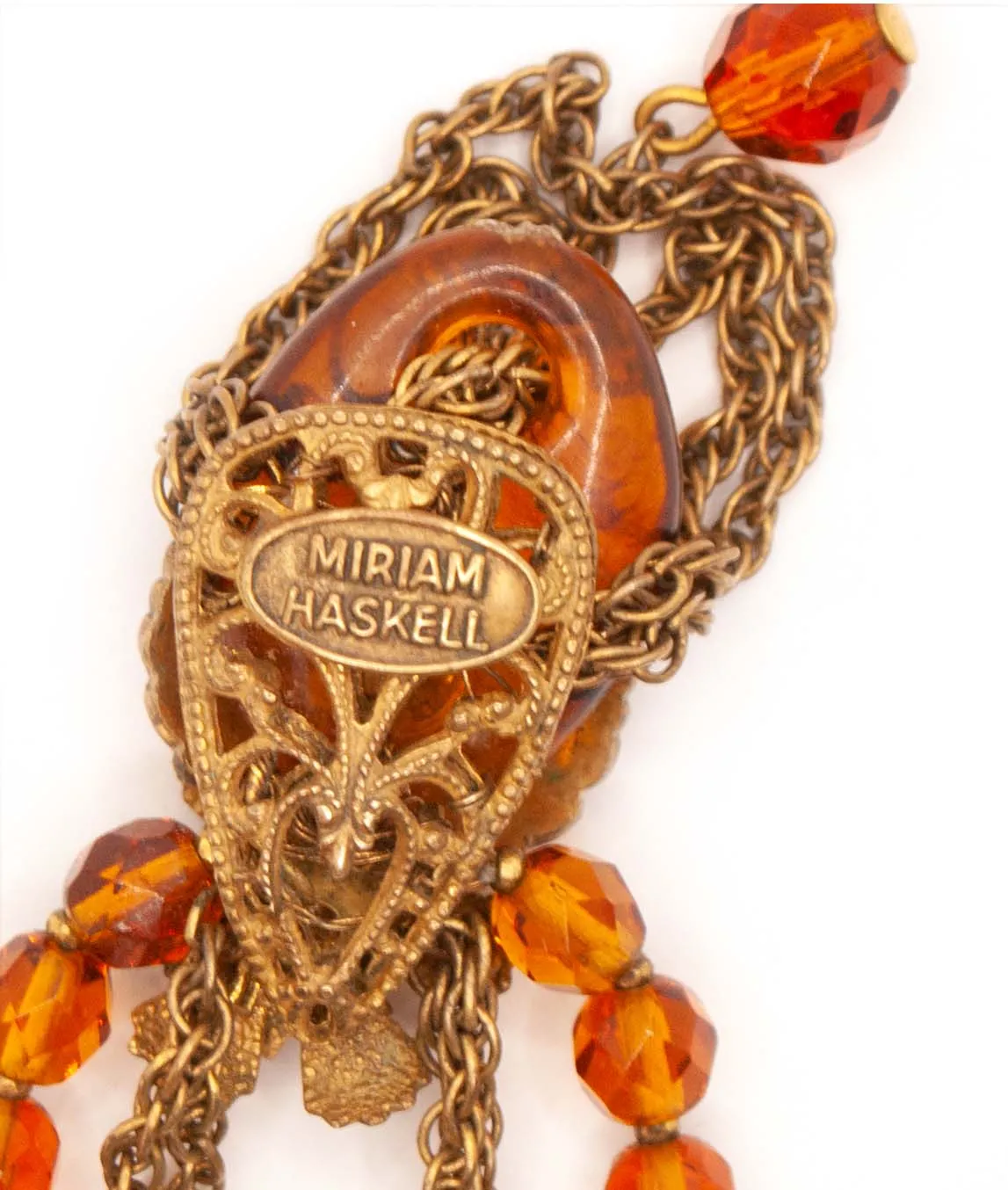 Miriam Haskell signature plaque on back of necklace pendant
