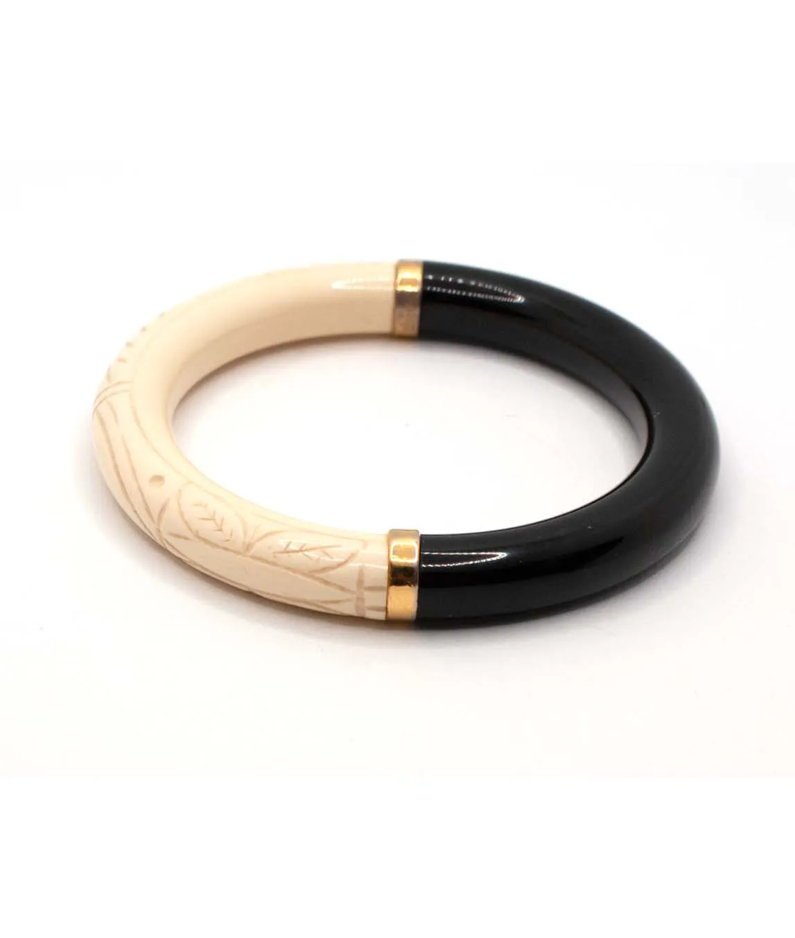 Sideview of black and carved ivory Givenchy bangle