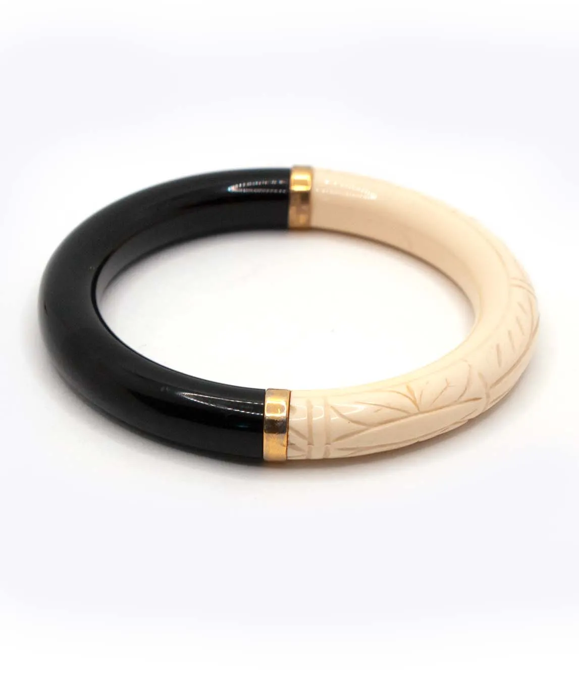 Sideview of black and ivory Givenchy bangle