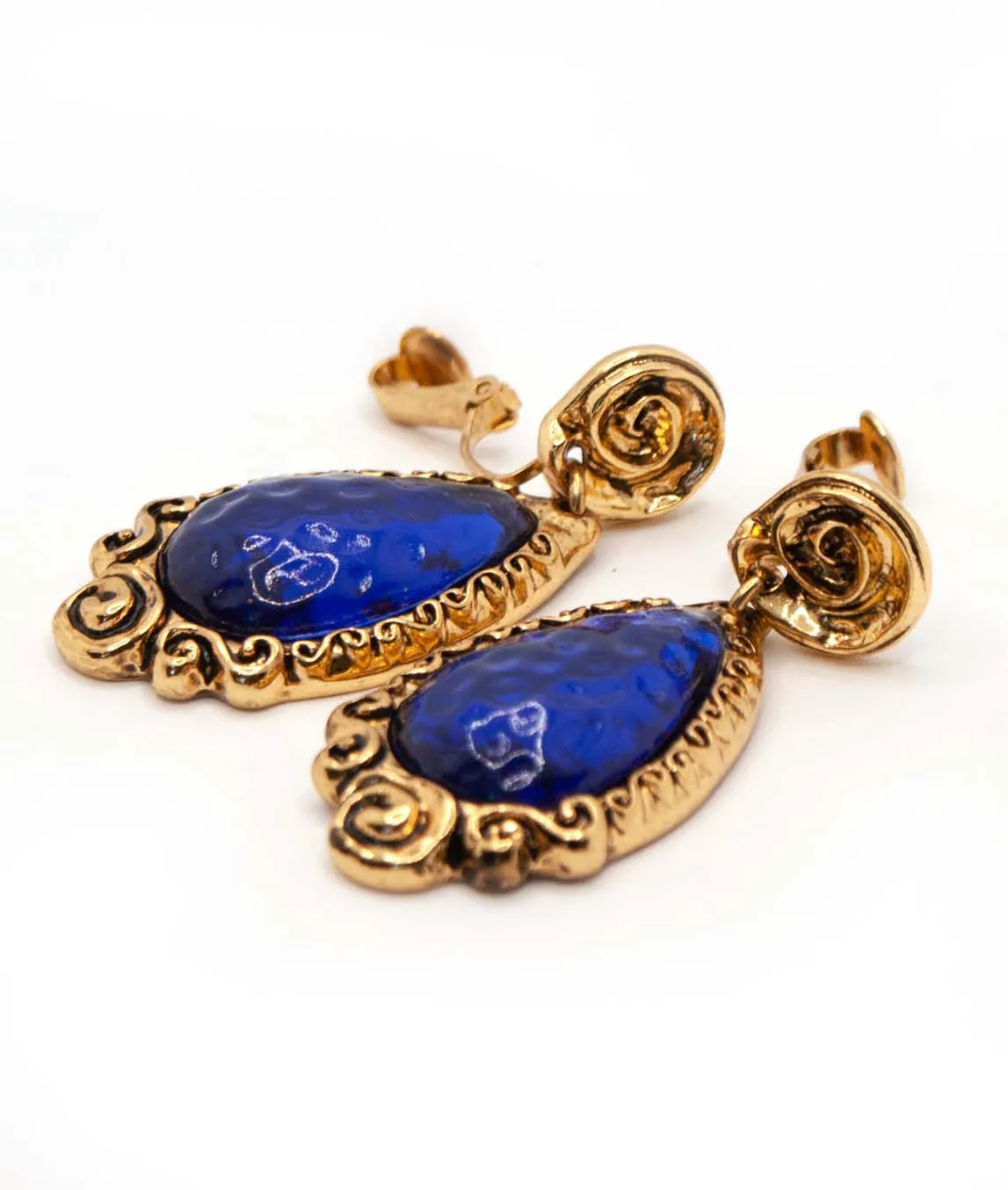 Profile view of blue glass Chrisian Lacroix vintage clip earrings