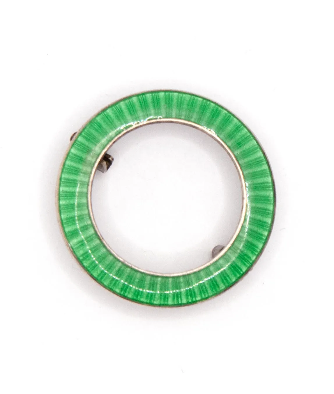 John Atkins & Sons Green enamelled ring shaped brooch pin set in silver on a white background