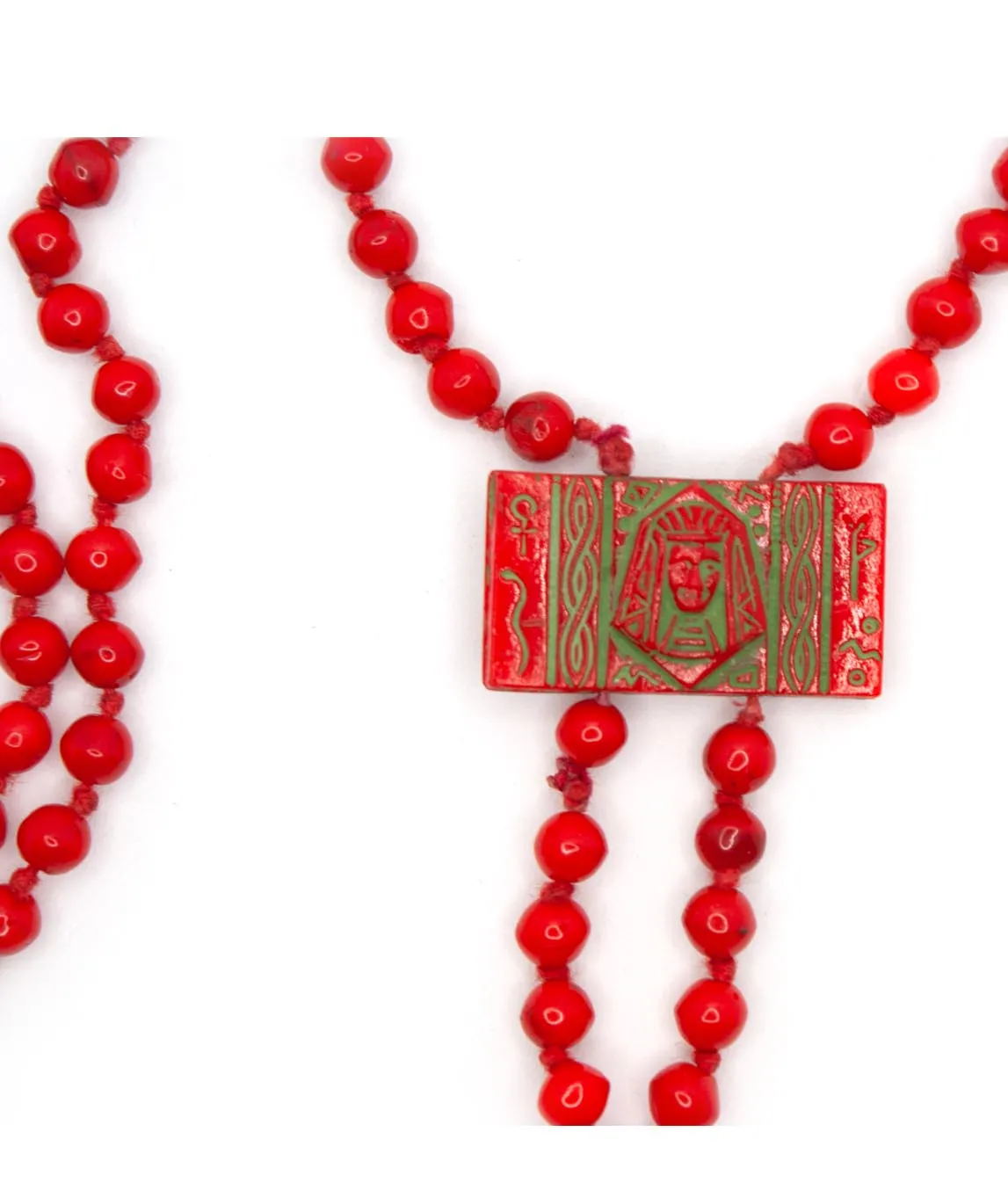 Rectangular red bead with green paint on Neiger brothers beaded necklace