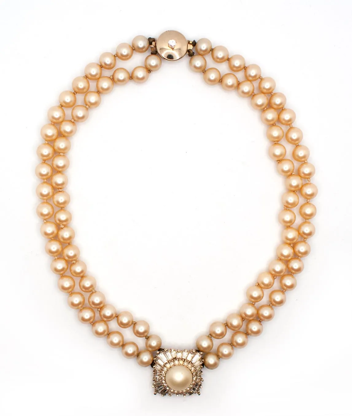 Top view of Panetta double strand faux pearl necklace with champagne beads and central pendant and push clasp
