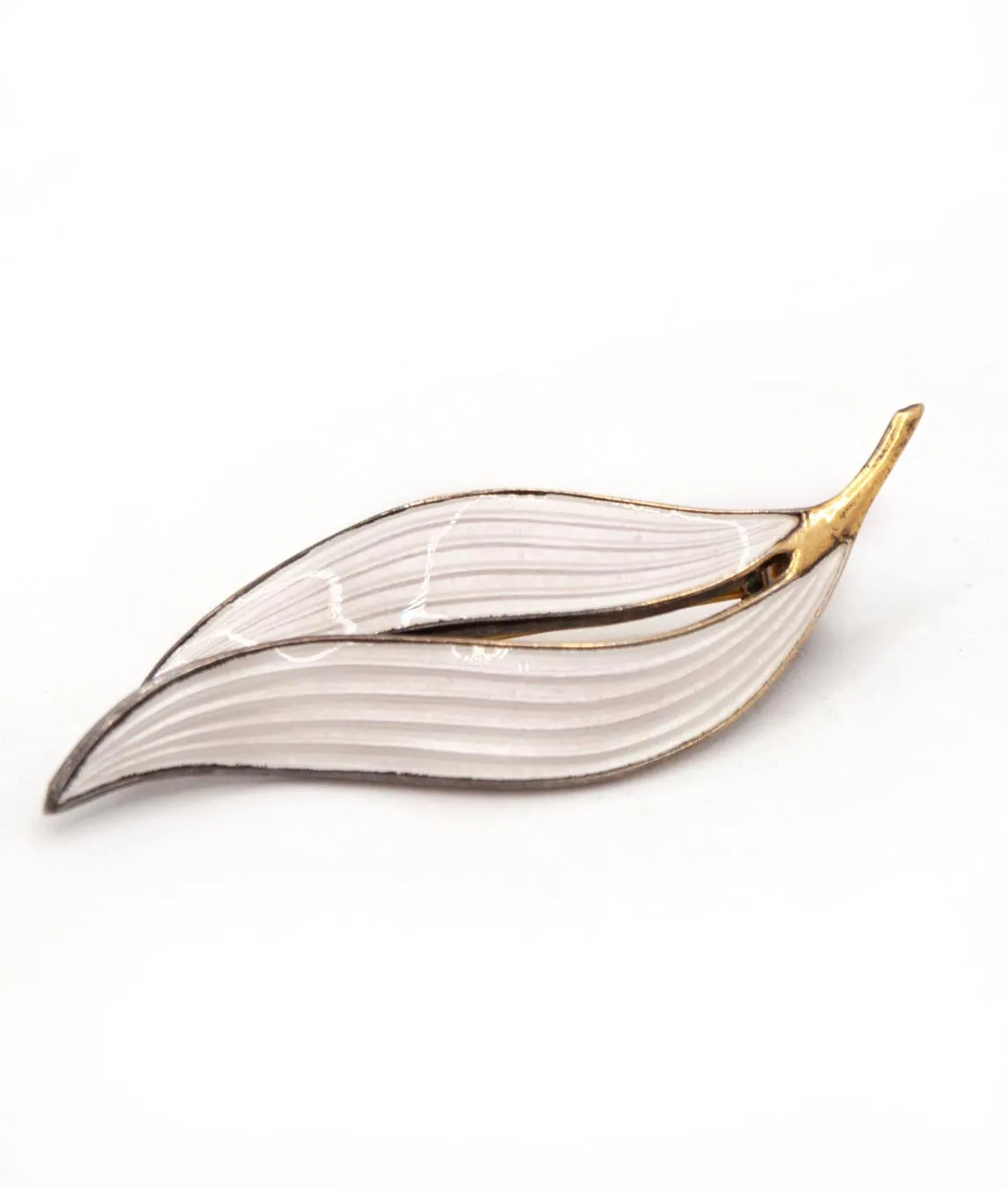 Aksel Holmsen double leaf brooch with lined white enamel with gilded silver stem