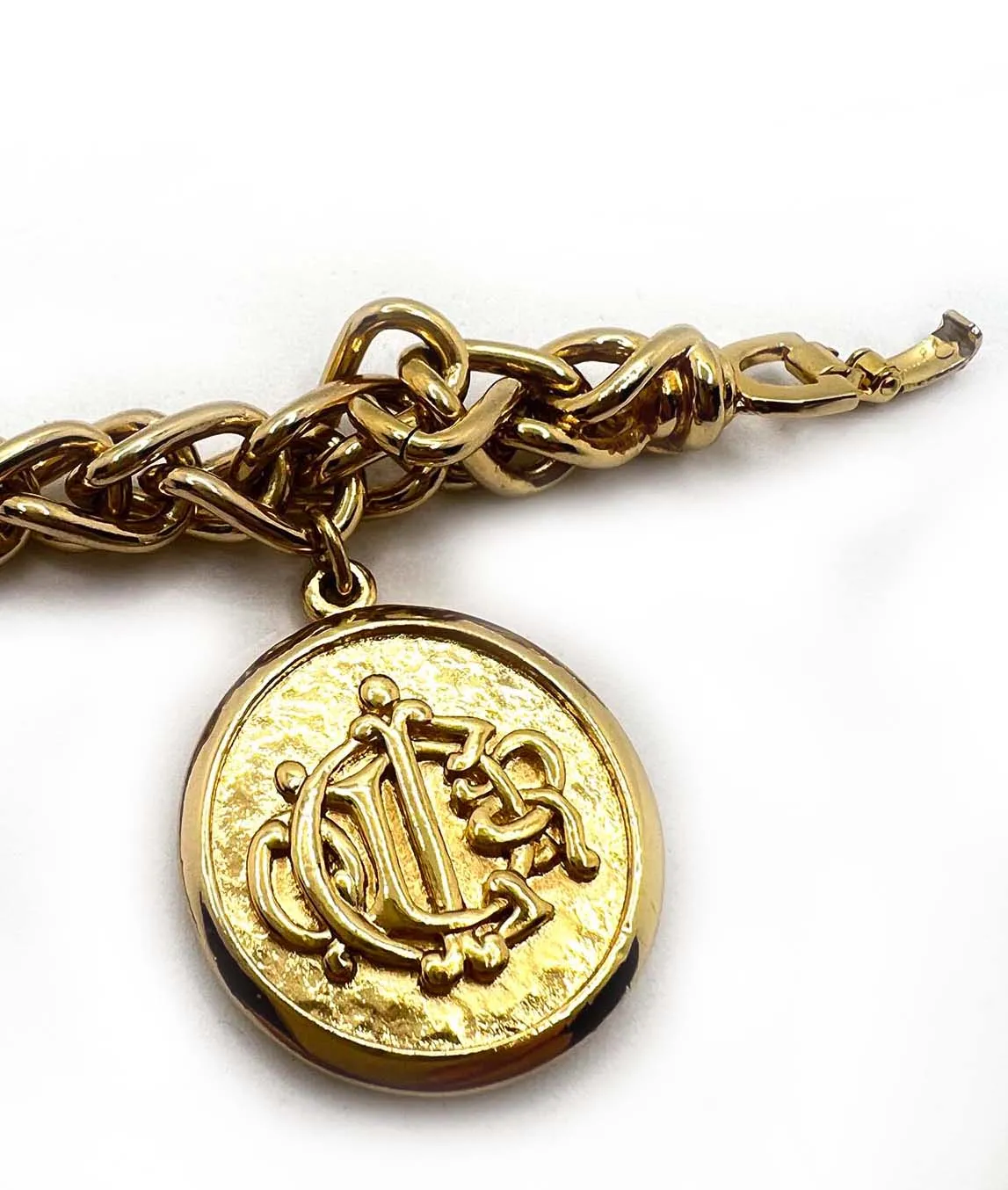 Gold plated Christian Dior logo coin on the end of a chain