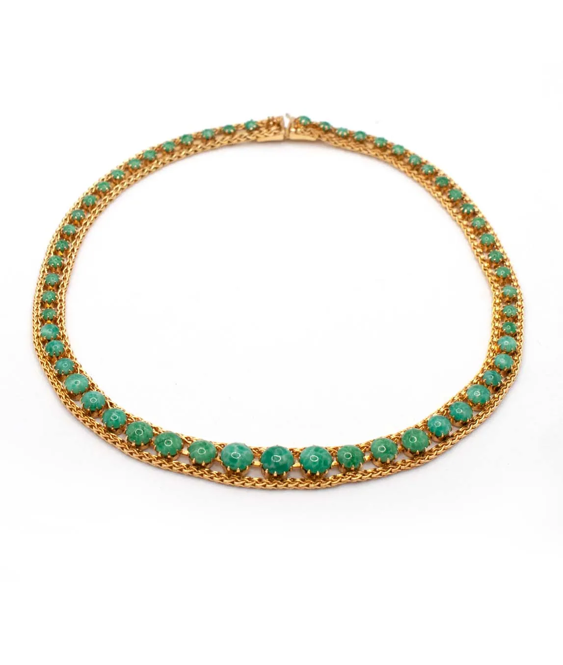 Vintage choker necklace by Christian Dior decorated with gold plated metal and round green glass stones - profile view