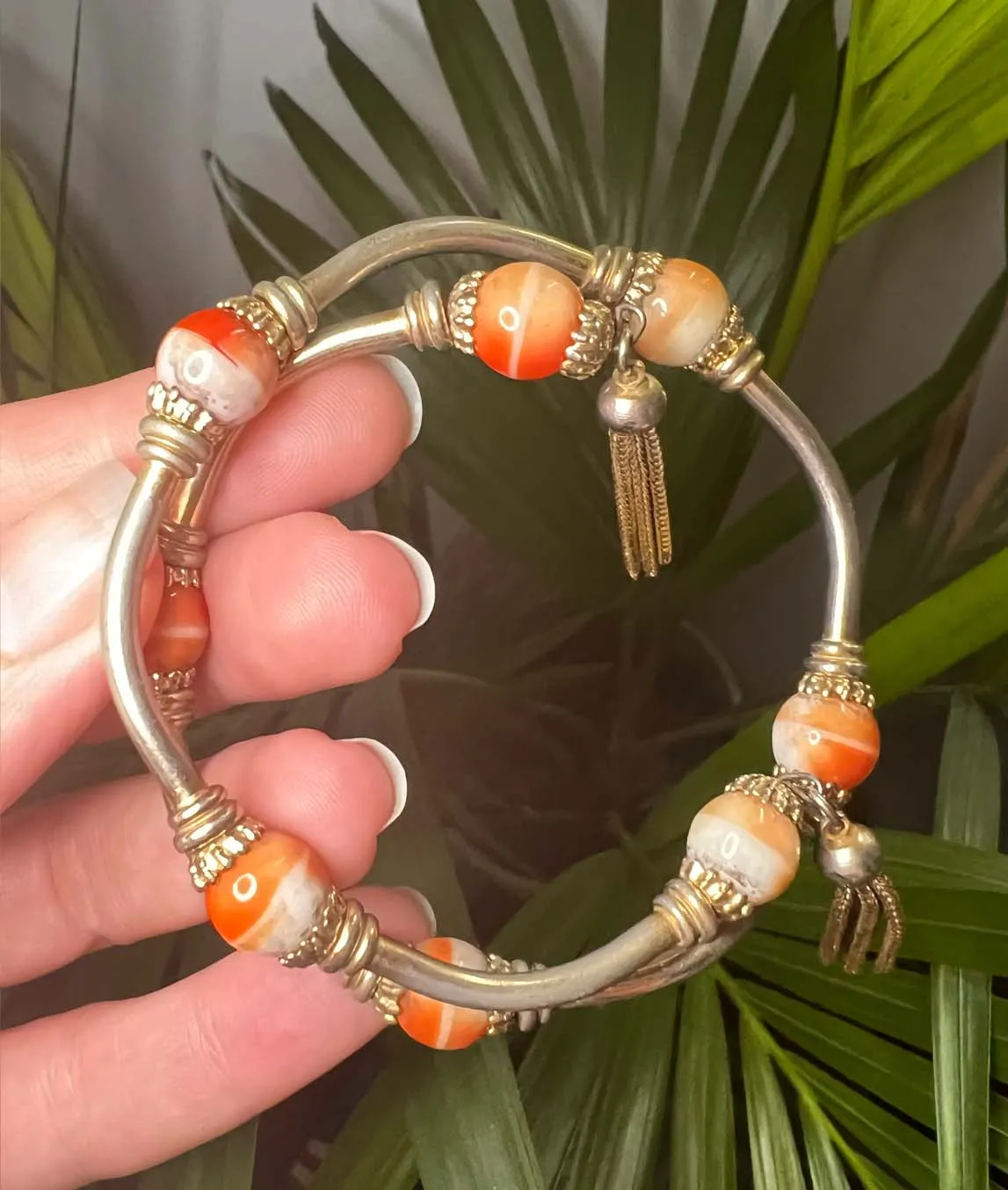 Miriam Haskell 1940s vintage wrap bracelet with orange art glass beads and metal tassels