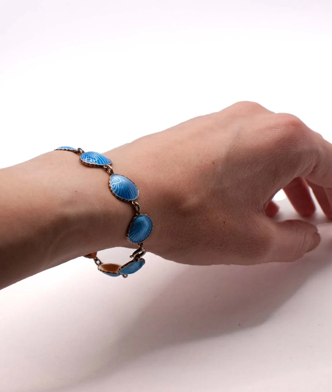 Vintage Blue enamel shell bracelet on a wrist