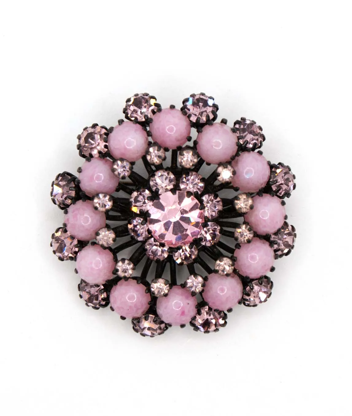 Pastel pink cluster brooch with pink rhinestones set on black metal