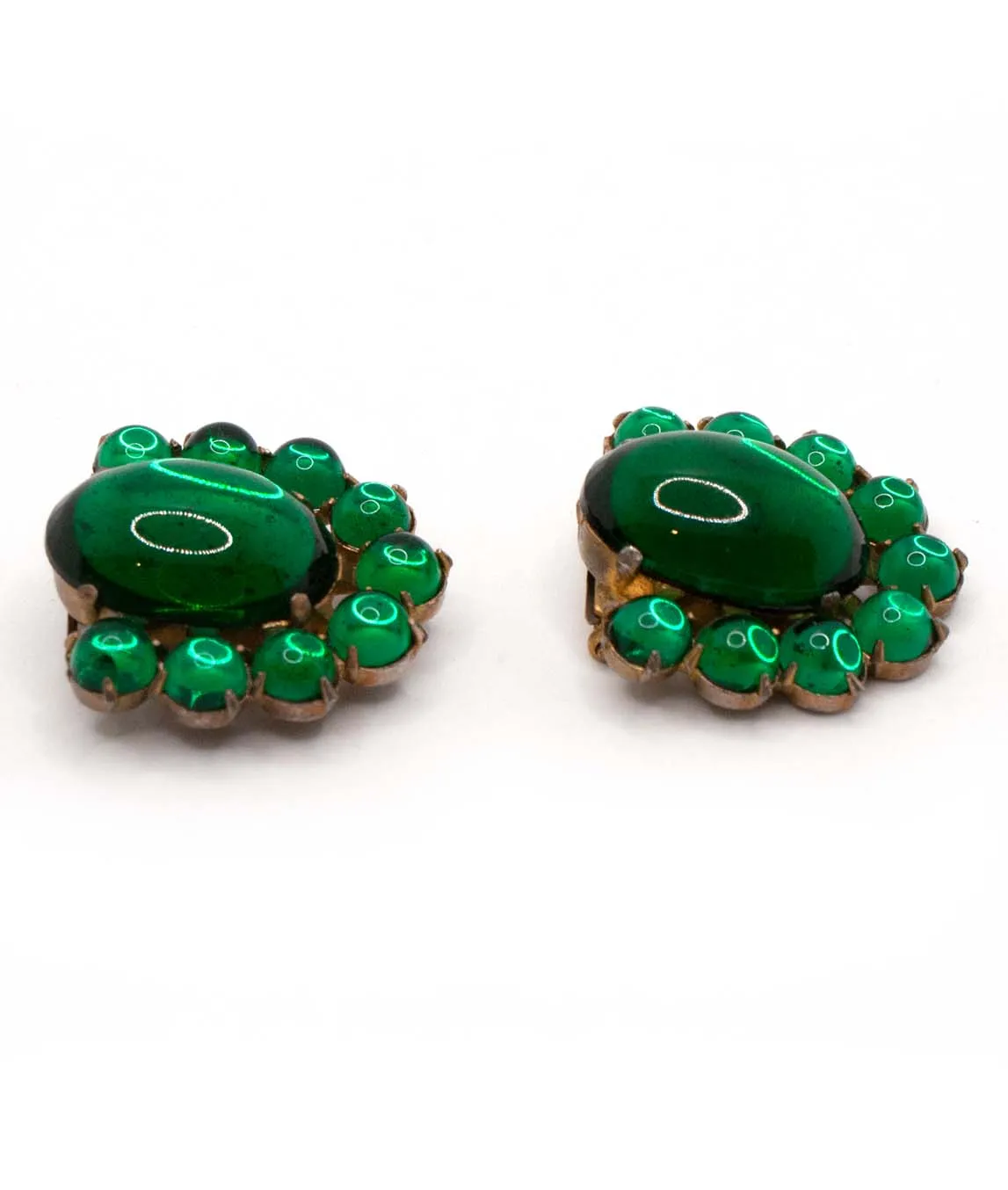 Pair of green glass cabochon dress clips with round glass stones as perimeter - side view