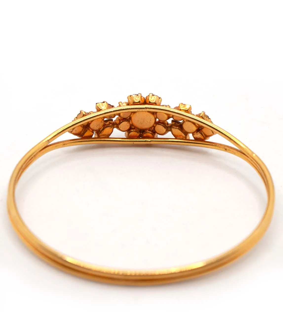 Back of floral detail on gold tone vintage bangle bracelet