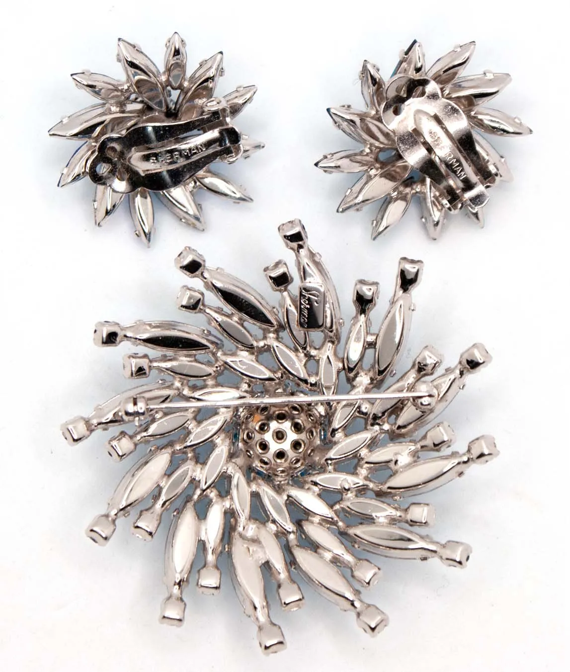 Back of Sherman earrings and brooch pin showing rhodium plated silver tone