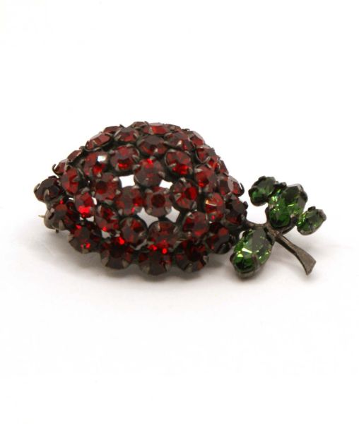 Shreiner red crystal strawberry brooch with green leaves profile view
