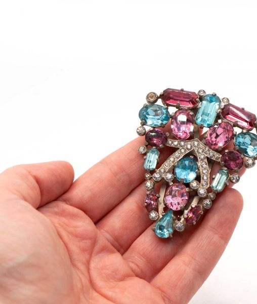 Large Eisenberg Original pink and turquoise fur clip held in hand